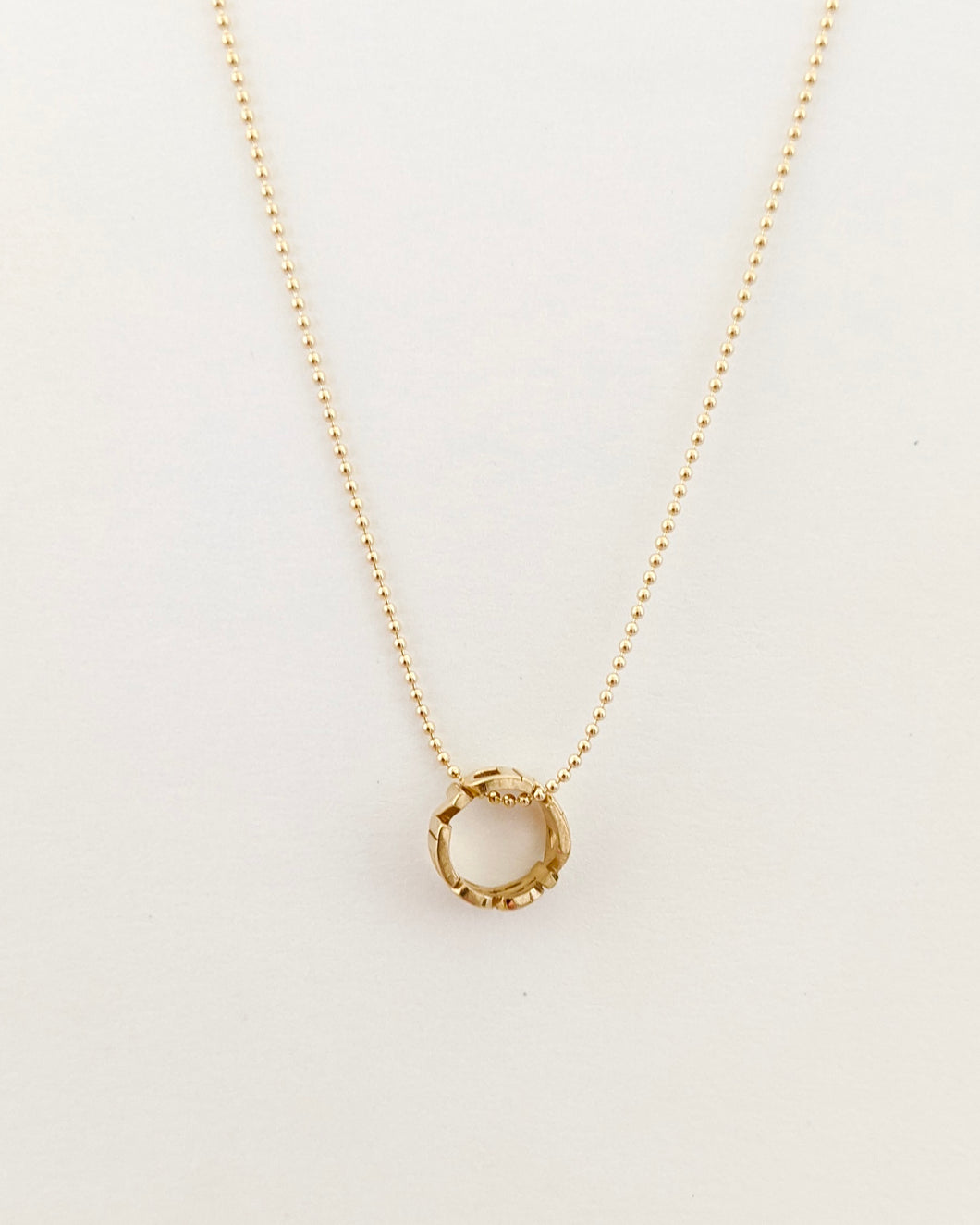 Reminder charm necklace in yellow gold